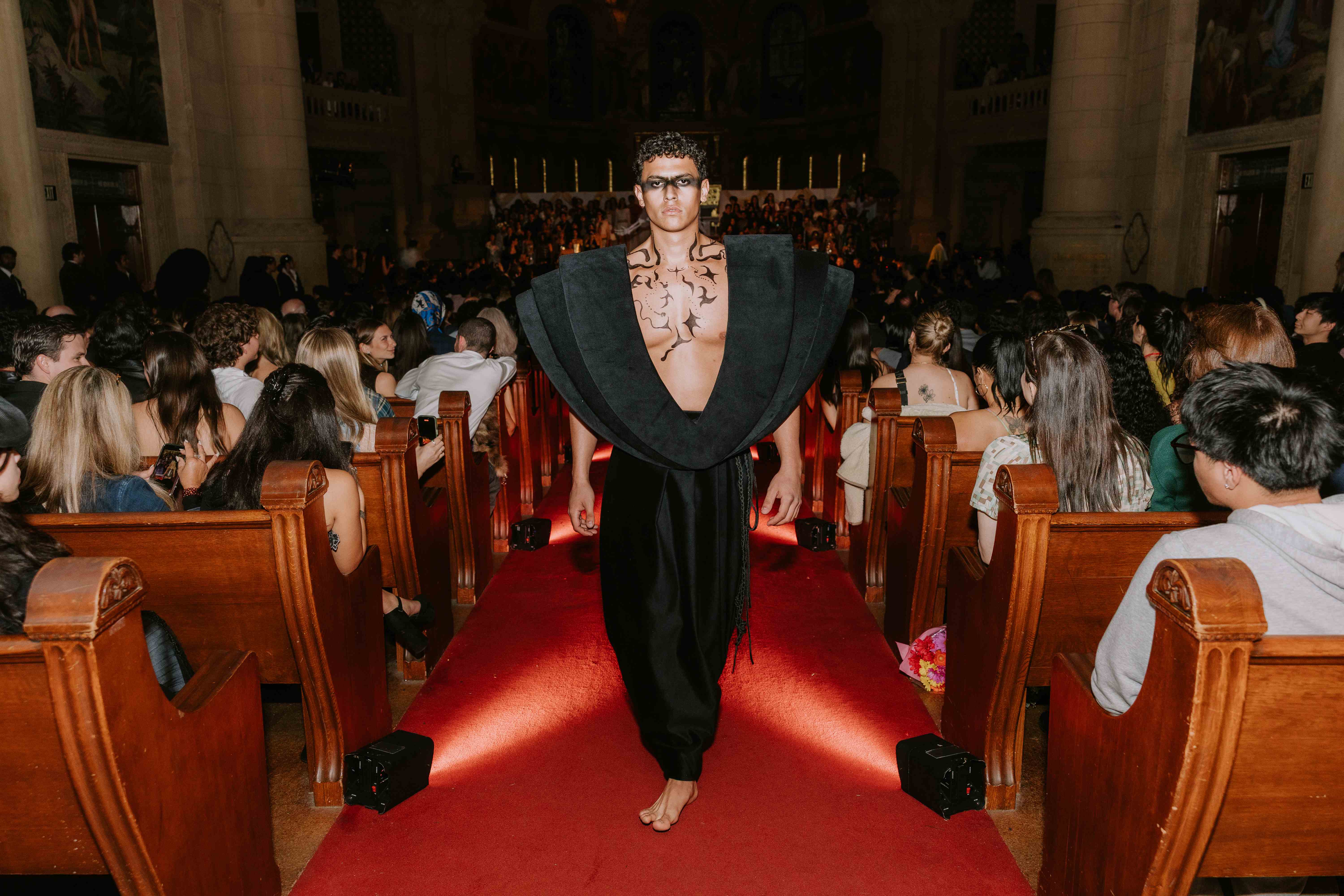 Model walking the runway at Stanford Memorial Church