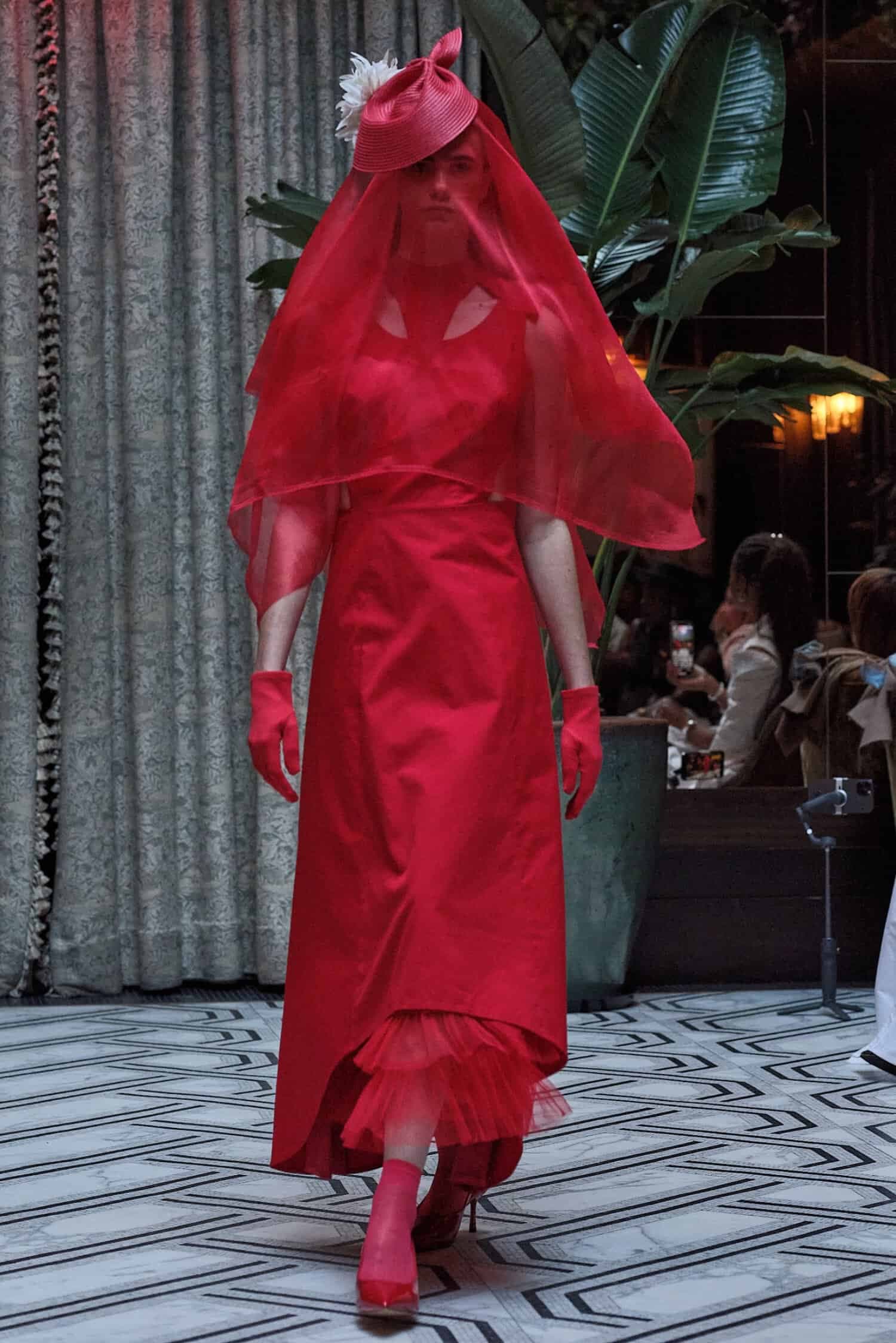 All-red ensemble with veil