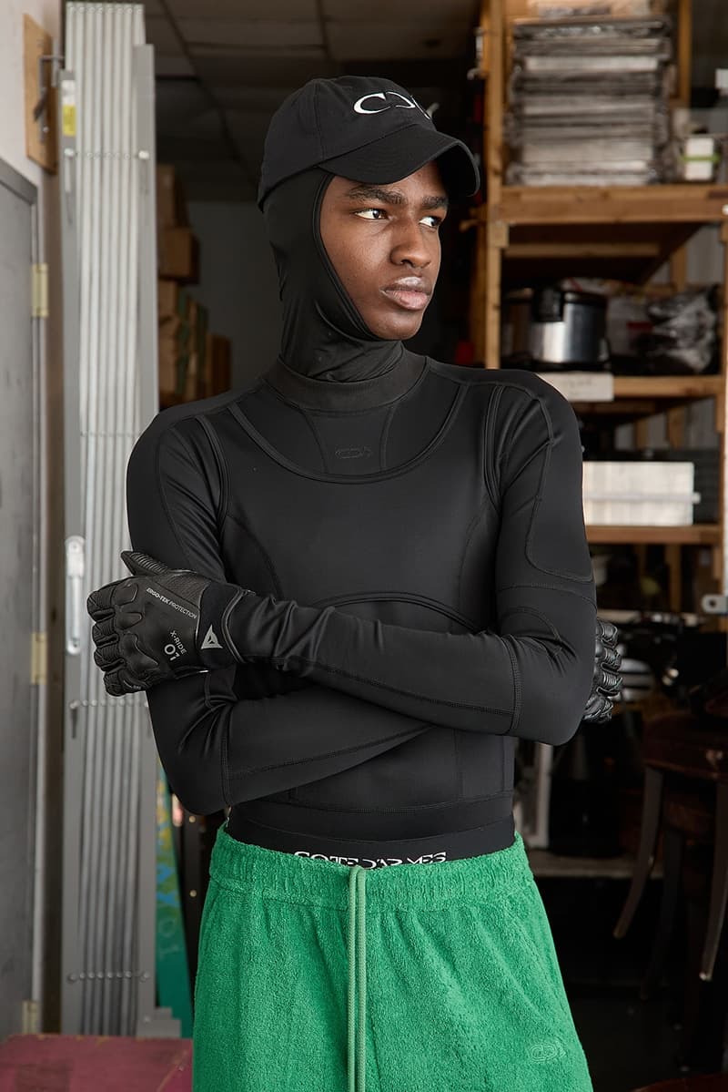 Black bodysuit with green shorts