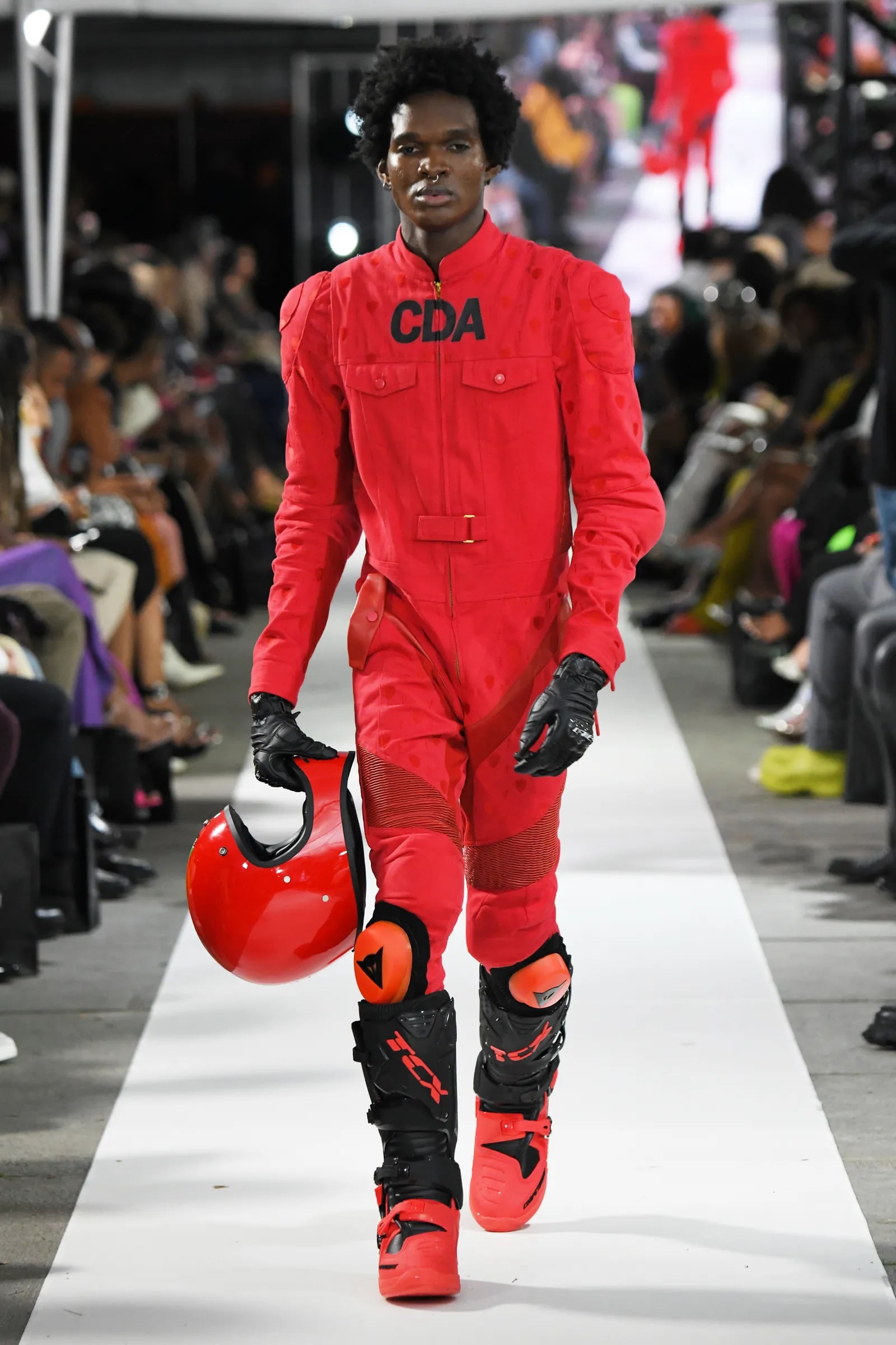 Fashion model in red racing suit