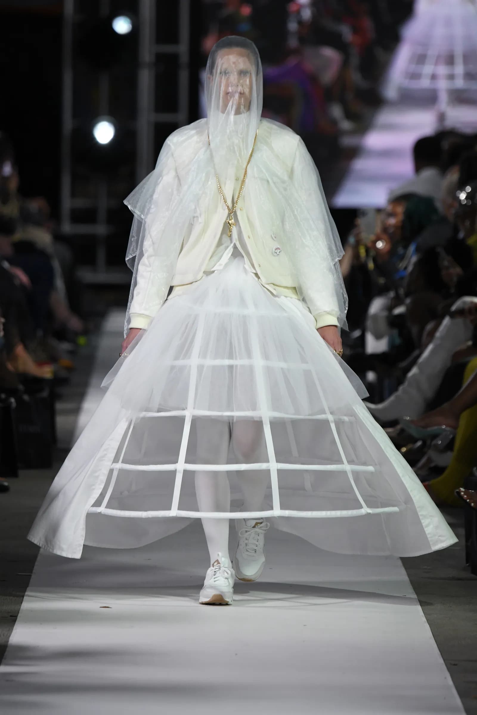 White ensemble with mesh veil